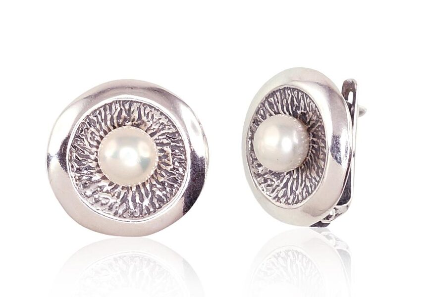 Silver earrings with an "English" clasp, oxide coating, and pearls.